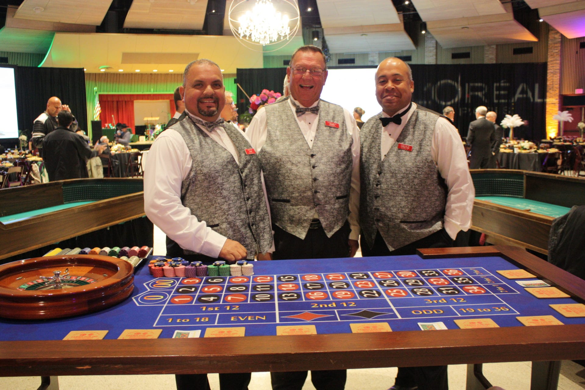 Three men working at a casino